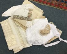 A selection of lace table cloths and place mats. E