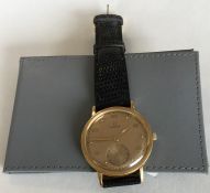 OMEGA - A gent's 18 carat wristwatch on leather st