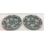 A pair of 18th Century English Delft wall chargers