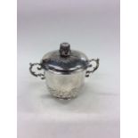 An early silver two handled porringer and cover wi