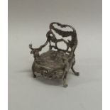 A novelty silver doll's house carver chair. London.