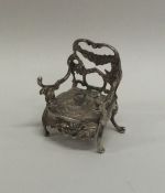 A novelty silver doll's house carver chair. London.