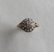 A 9 carat gold paste set cluster ring. Approx. 2.7