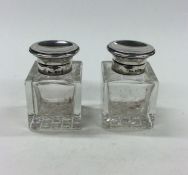 A pair of silver hinged top inkwells. Birmingham.