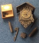 An old wooden cuckoo clock. Est. £20 - £30.