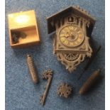 An old wooden cuckoo clock. Est. £20 - £30.