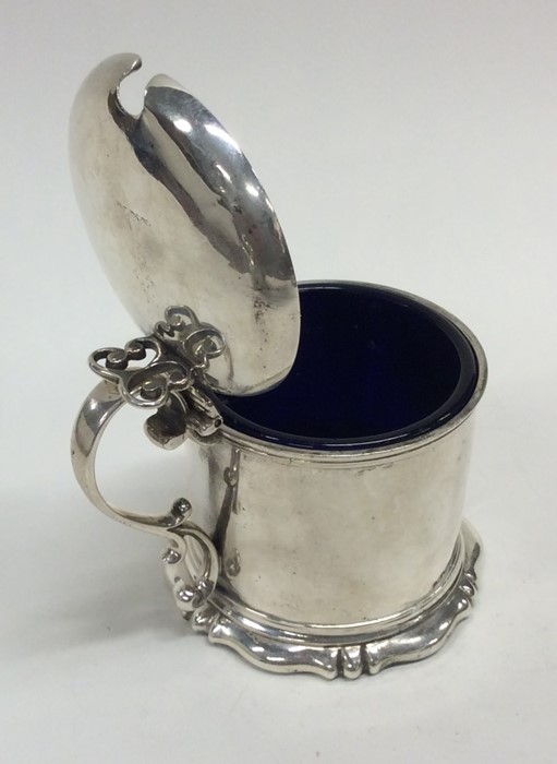 A Victorian hinged top mustard pot on scroll base. - Image 2 of 2