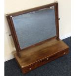 A Georgian mahogany three drawer toilet mirror on