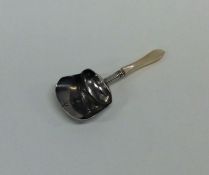A Georgian silver bright cut caddy scoop with tape