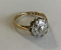 A small 18 carat gold diamond cluster ring. Approx