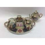 A 20th Century gilded tea service on matching tray