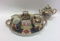 A 20th Century gilded tea service on matching tray