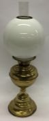 A brass mounted oil lamp. Est. £15 - £20.