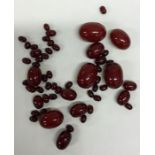 A quantity of red amber beads. Approx. 131 grams.