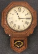 A large oak school clock decorated with gilding. A
