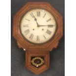 A large oak school clock decorated with gilding. A