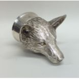 A massive silver stirrup cup in the form of a fox'