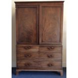 A good Georgian four drawer linen press with fitte