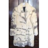 A stylish fur coat with silk lining together with