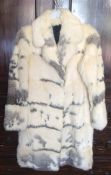 A stylish fur coat with silk lining together with