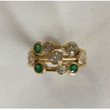 A modernistic 18 carat emerald and diamond ring in