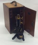 A large mahogany cased microscope. By W Watson of