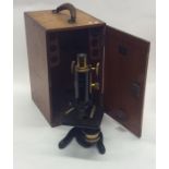 A large mahogany cased microscope. By W Watson of