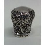 A Victorian silver embossed cane handle. London. B