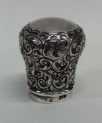 A Victorian silver embossed cane handle. London. B