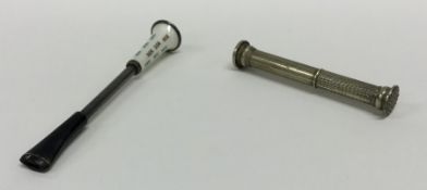 A silver and enamelled cigarette holder together w