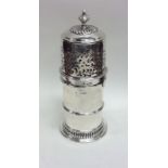 A massive silver lighthouse sugar caster with pier