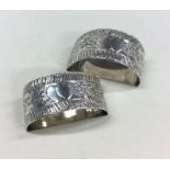 A pair of heavy silver napkin rings with heart dec