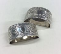 A pair of heavy silver napkin rings with heart dec