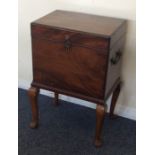 A mahogany cellerette with hinged top to fitted in