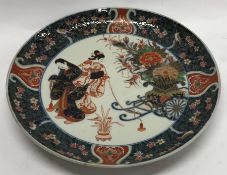 A large Chinese charger attractively decorated wit