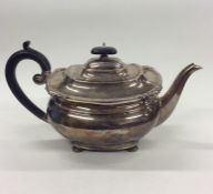 An Edwardian silver teapot with gadroon rim. Sheff