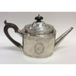 An attractive Georgian silver bright cut teapot wi