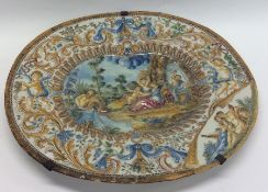 A large Italian oval Faience charger decorated in