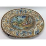 A large Italian oval Faience charger decorated in