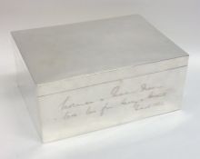 A massive hinged top silver cigar box with fitted