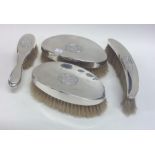 Four silver mounted brushes. London. By WC. Approx