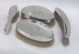 Four silver mounted brushes. London. By WC. Approx