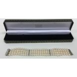 A good quality pearl four strand bracelet with pla