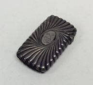A silver fluted vesta case with hinged top and flu