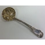A Georgian silver ladle attractively decorated wit
