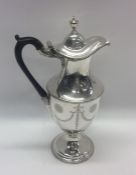 An attractive Georgian silver wine ewer with swag