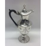 An attractive Georgian silver wine ewer with swag