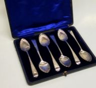 A boxed set of six bright cut Georgian silver teas