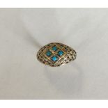 A turquoise four stone ring in gold. Approx. 3 gra