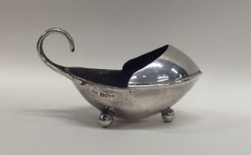 A novelty Edwardian silver salt with pouring lip o